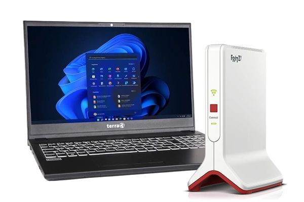 Laptop met geopend scherm en een FRITZ!Box modem ernaast.